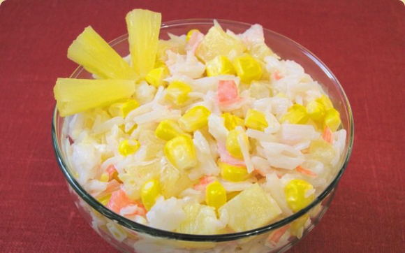 Salad with crab sticks, corn and pineapple