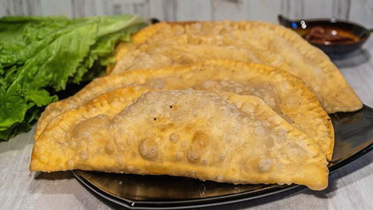 Pastries stuffed with minced meat and onions