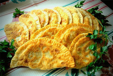 Chebureks with cheese and potatoes