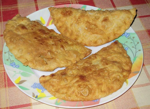 Chebureks with potatoes and onions