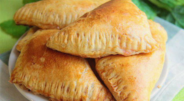 Puff pastry envelopes with sausage and cheese