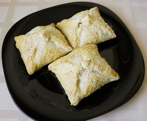 Puff pastry envelopes with cheese in the oven