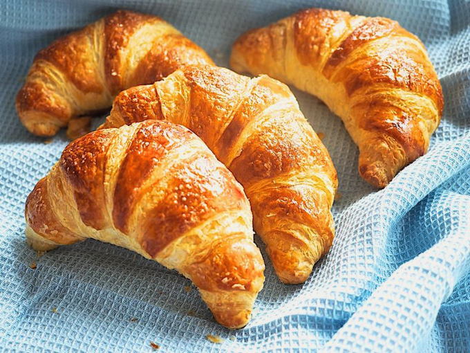 Croissants with condensed milk from puff yeast dough