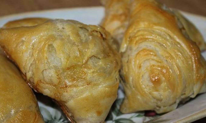 Samsa with minced puff yeast-free dough in the oven