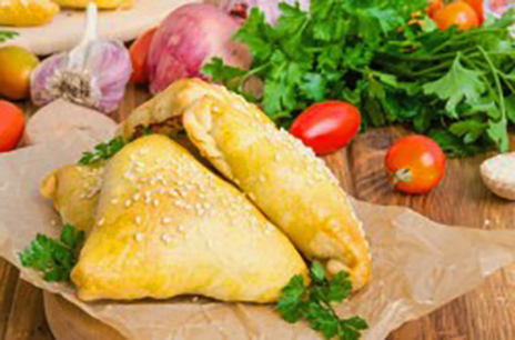 Samsa from puff pastry with chicken in the oven at home