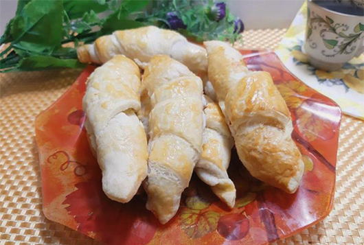 Croissants with condensed milk in the oven