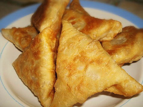 Samsa from puff pastry in a pan