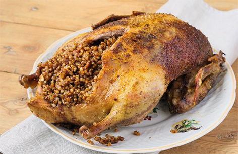 Duck with buckwheat and prunes in the oven