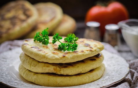 Flatbreads with Adyghe cheese in a pan