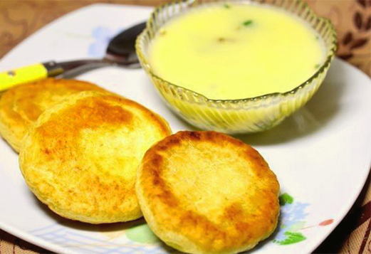 Cheese cakes in water and flour in a pan