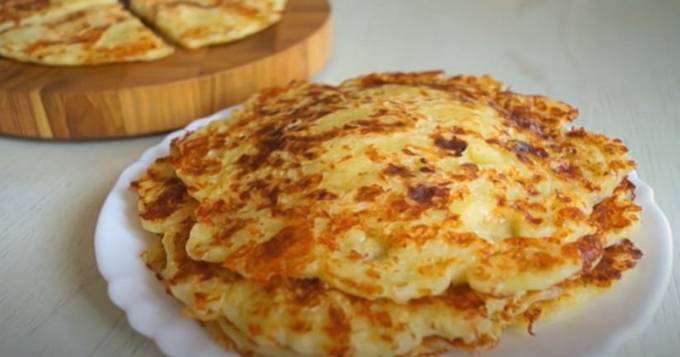 Cheese cakes in milk in a pan