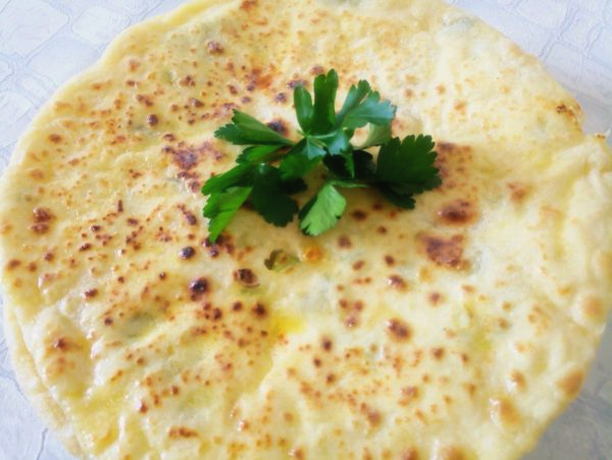 Tortillas with cheese, cottage cheese and herbs in a pan