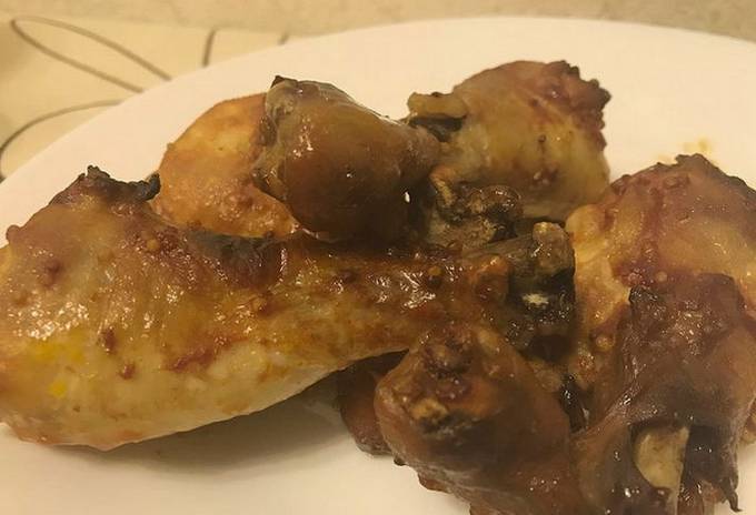 Chicken legs in honey mustard sauce in the oven