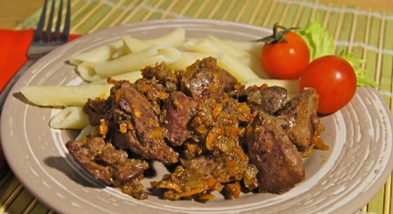 Chicken liver with onions and carrots in a pan