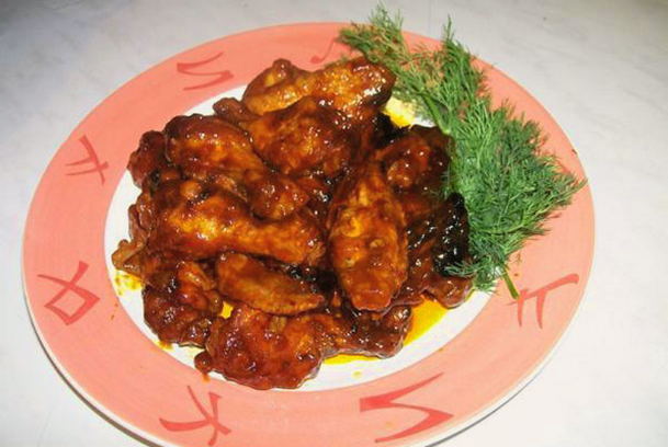 Chicken wings in honey and soy sauce in a pan