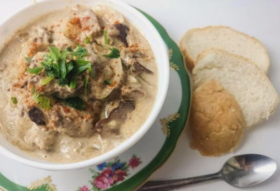 Chicken liver with gravy with onions in a pan