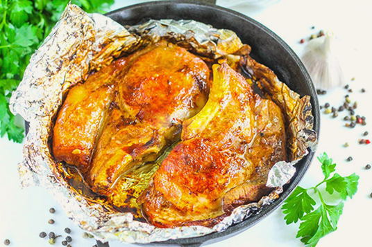 Pork loin in a piece in foil in the oven