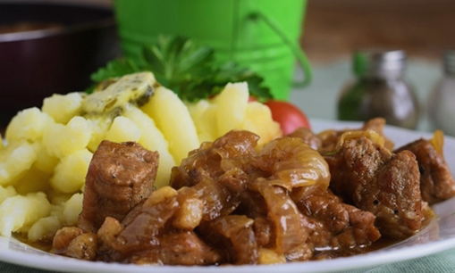 Soft and juicy pork in pieces, fried in a pan