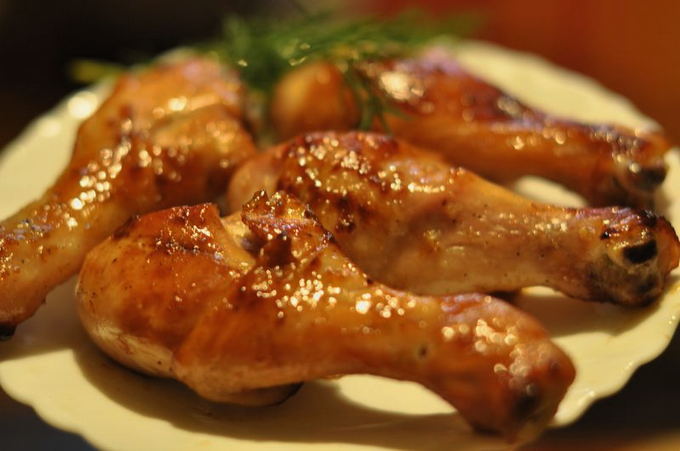 Chicken legs in honey-soy sauce in a pan