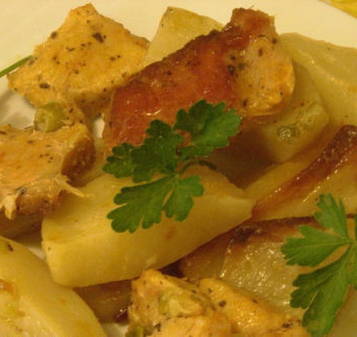 Pork pieces with potatoes in foil in the oven