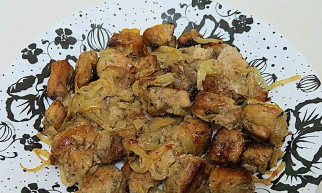 Pieces of pork baked in a sleeve in the oven