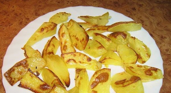 Potato wedges in foil in the oven