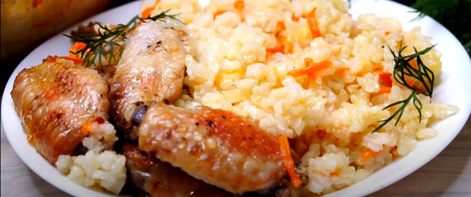 Pilaf with chicken in a glass dish in the oven