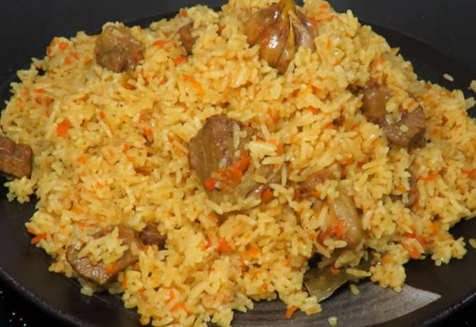 Pilaf with turkey in a pan