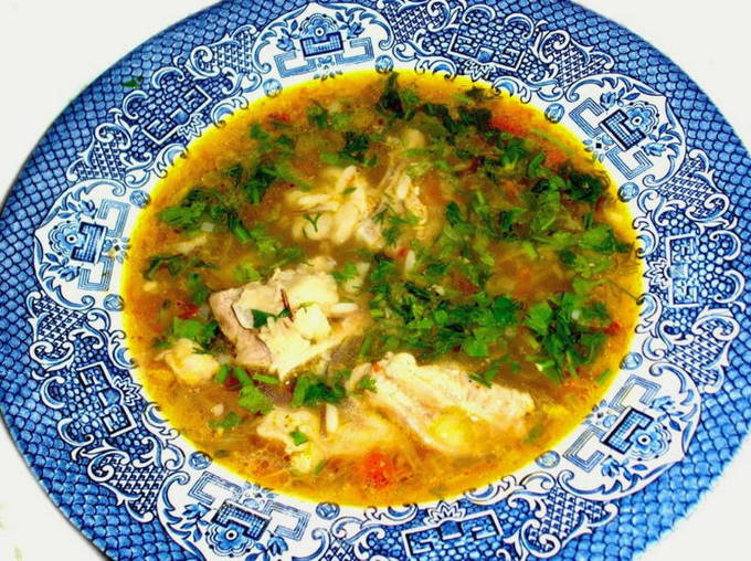 Soup kharcho on chicken broth with potatoes and rice