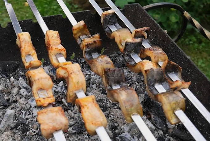 Fish kebab on skewers on the grill