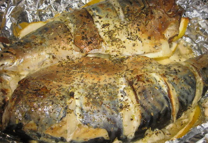 Mackerel with mayonnaise in foil on the grill
