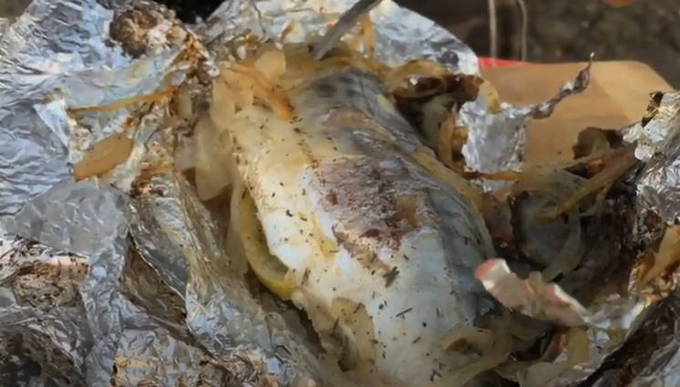 Mackerel with lemon in foil on the grill