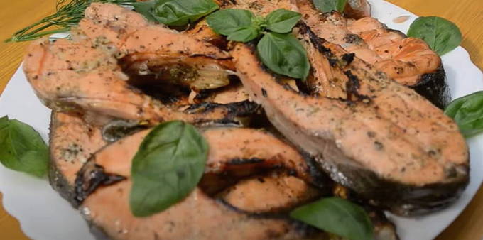 Trout in lemon marinade on a grill on the grill