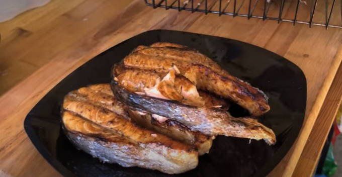Trout steaks with soy sauce on the grill