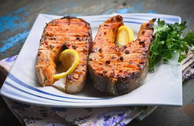 Trout steaks on a grill on the grill