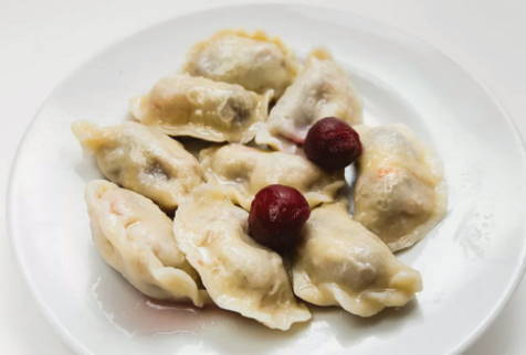 Dumplings with cherries on the water