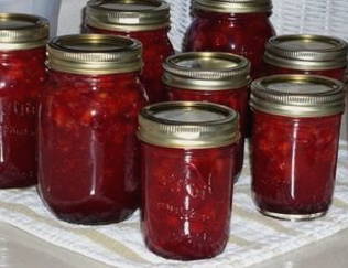 Lingonberries in their own juice for the winter with sugar
