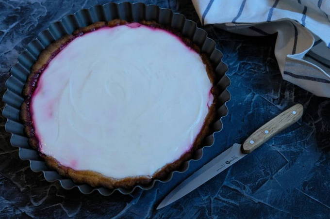 Open pie with lingonberry and sour cream
