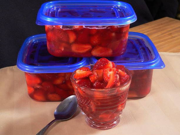 Strawberries in the freezer in sugar syrup for the winter