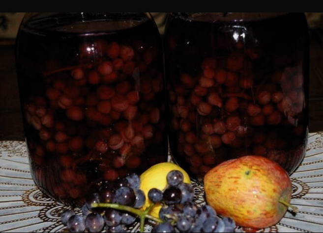 Pear and grape compote in a 3-liter jar for the winter