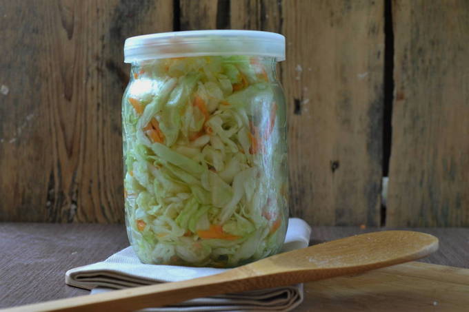 Pickled cabbage with carrots and vinegar in an instant can