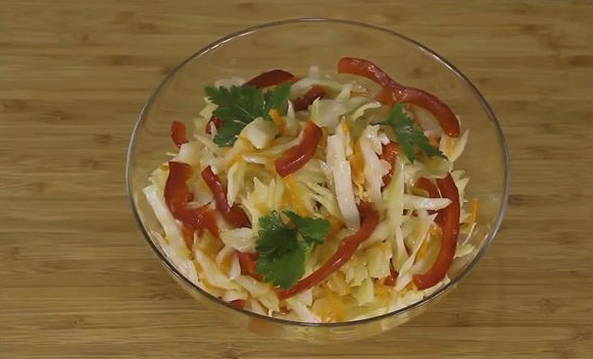 Pickled cabbage with carrots, bell peppers and instant butter