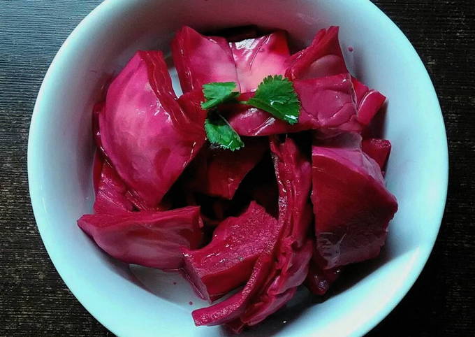 Pickled cabbage in large pieces with beets and instant garlic in jars