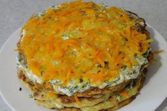 Zucchini cake with carrots and onions