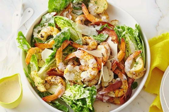 Caesar salad with shrimps and squid